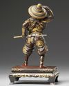 A Japanese parcel gilt bronze figure of a Samurai