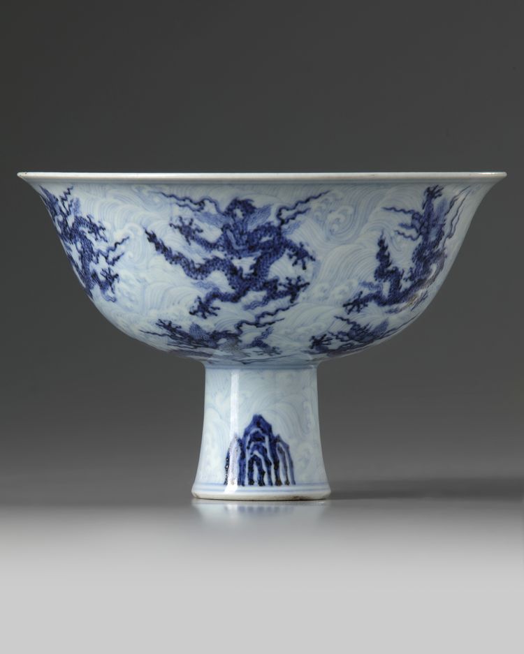 A Chinese blue and white 'nine dragon' stem bowl