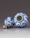 Two blue and white miniature vessels