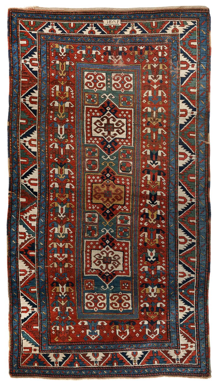 A CAUCASIAN FAHRALUO KAZAK RUG, 19TH CENTURY