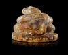 A ROMAN AMETHYST FIGURE OF A COILED SNAKE, 2ND-3RD CENTURY AD