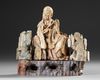 A CHINESE SOAPSTONE FIGURE OF A DAOIST IMMORTAL, 19TH CENTURY