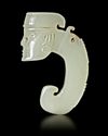 A WHITE JADE DRAGON PENDNT WITH A HUMAN HEAD, CHINA, SHANG DYNASTY