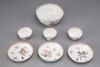 A Lowestoft bowl and three cups and saucers
