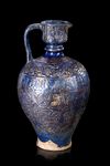* A MONUMENTAL LAJVARDINA POTTERY JUG, ILKHANID PERSIA, 13TH CENTURY