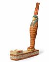 AN EGYPTIAN WOOD FIGURE OF PTAH-SOKAR-OSIRIS, LATE PERIOD, CIRCA 664-332 B.C.