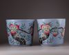 A pair of Chinese blue-ground famille rose 'nine peach' jardinieres