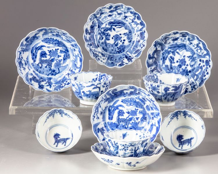 Five blue and white cups and saucers