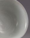 A Chinese Shufu-style white-glazed moulded 'dragon' bowl