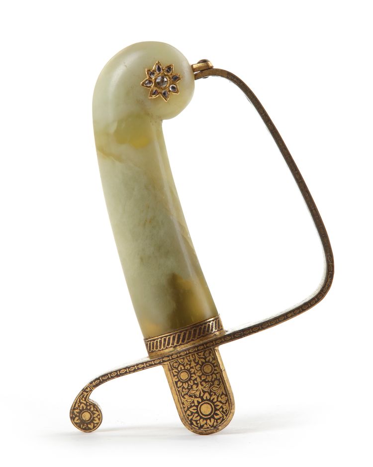 A MUGHAL JADE SWORD HILT, INDIA, 19TH-20TH CENTURY