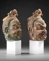 TWO CHINESE POLYCHROME WOOD HEADS, MING DYNASTY OR LATER