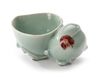 A CHINESE CELADON WATER DROPPER IN THE SHAPE OF A PEACH, 18TH CENTURY