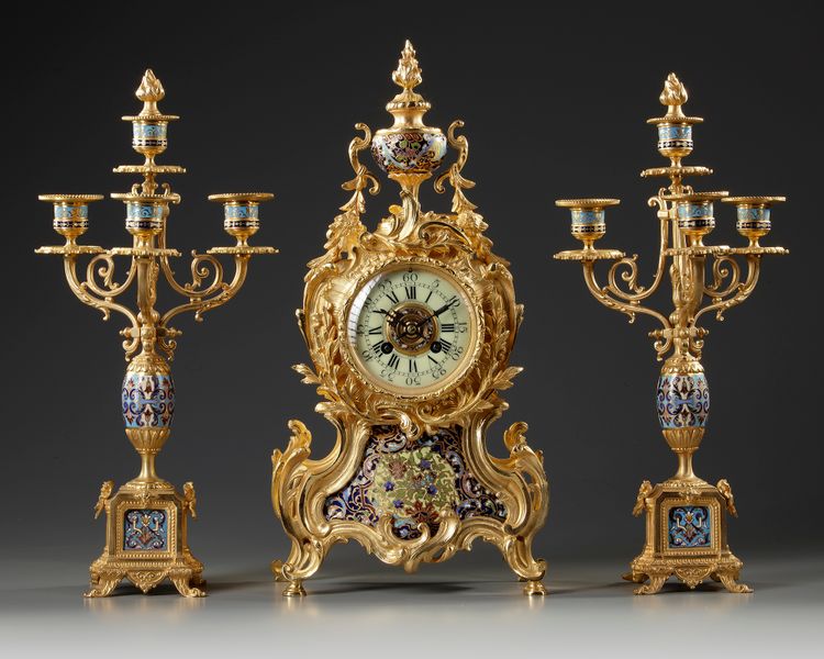 A FRENCH CHAMPLEVÉ ENAMEL CLOCK SET, 19TH CENTURY