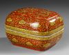A CHINESE YELLOW-DECORATED RED-GROUND DRAGONS BOX AND COVER, QING DYNASTY (1644–1911)