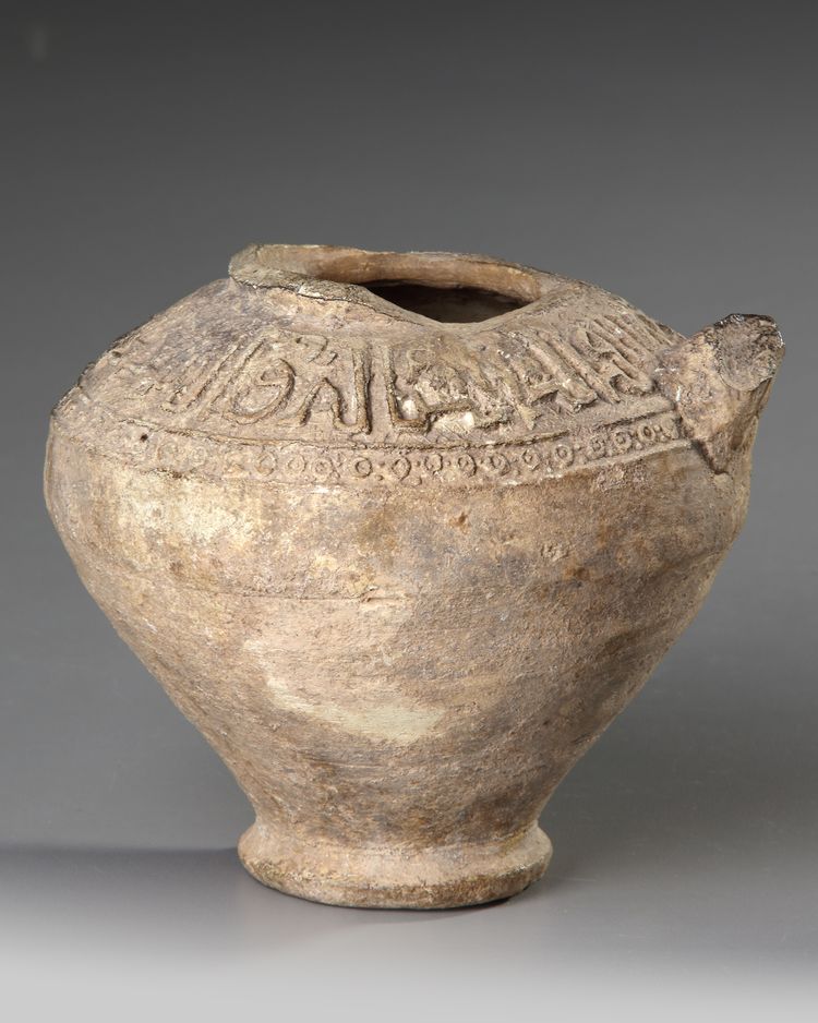 A SELJUK UNGLAZED MOULDED POTTERY VESSEL, PERSIA, 12TH-13TH CENTURY