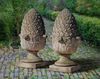 A PAIR OF CARVED LIMESTONE PIER FINIALS, 20TH CENTURY