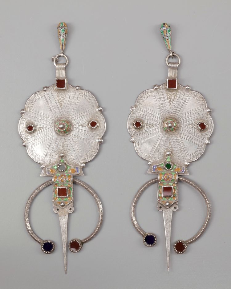 A pair of silver with mineral stone inlay fibula