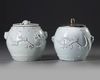 TWO CHINESE BLANC DE CHINE BARREL SHAPED JARS AND A COVER, 18TH CENTURY