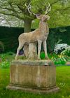 A LARGE AND IMPRESSIVE SCULPTED LIMESTONE AND ANTLER MOUNTED MODEL OF A STAG, LATE 20TH CENTURY