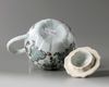 A Chinese famille rose moulded 'floral' teapot and cover