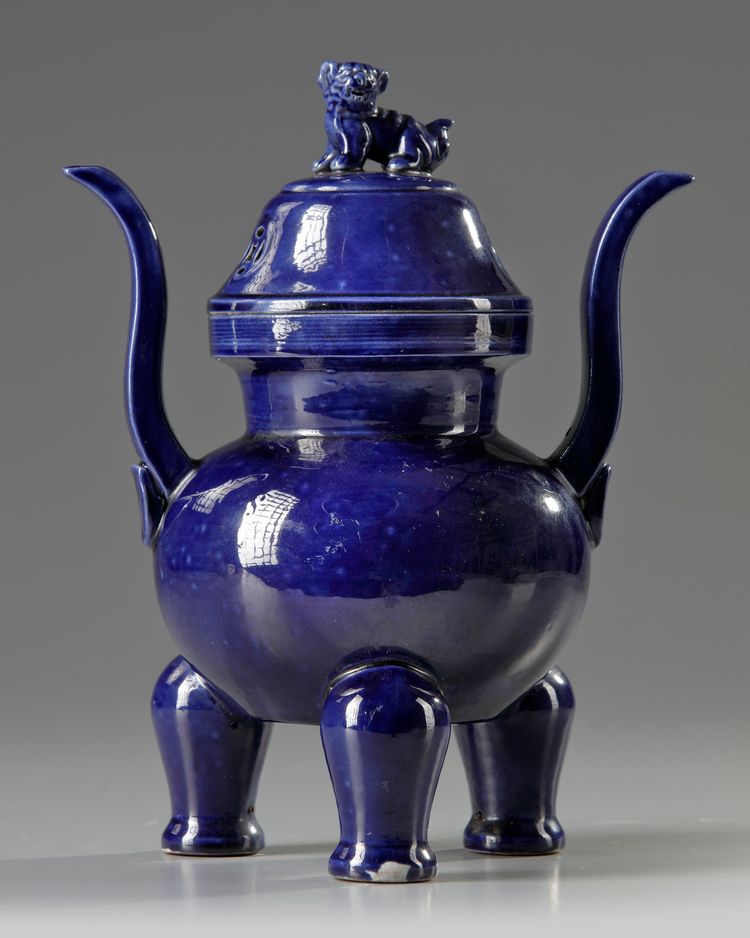 A Chinese blue-glazed tripod censer and cover
