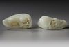TWO LARGE CHINESE PALE CELADON JADE 'BOYS' CARVINGS, 20TH CENTURY