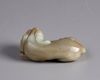A Chinese celadon jade mythical beast