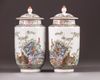 A pair of small Chinese famille rose lantern vases and covers