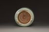 A Chinese celadon glazed tripod censer