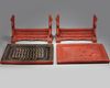 A pair of Chinese cinnabar lacquer 'Luohan' table screens
