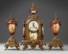 A SPELTER AND RED PORCELAIN CLOCK SET, 19TH CENTURY