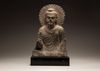 A Gandharan grey schist Buddha