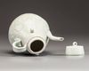 A Chinese celadon-glazed carved ewer and cover