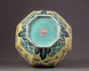A Chinese yellow-ground octagonal famille rose 'dragon' bottle vase
