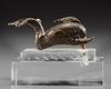 A ROMAN BRONZE DOLPHIN FIGURE, CIRCA 1ST- 2ND CENTURY A.D.