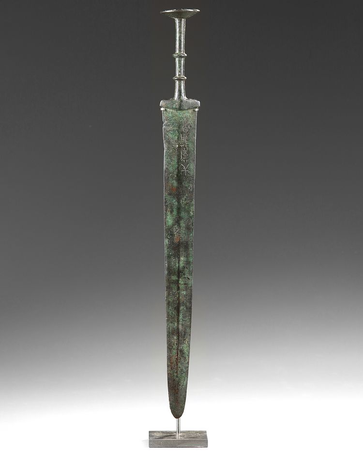 A Chinese inscribed bronze sword