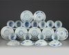 A set and a matched set of Chinese blue and white ‘flower scroll’ cups and saucers