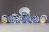 A lot of twelve blue and white items
