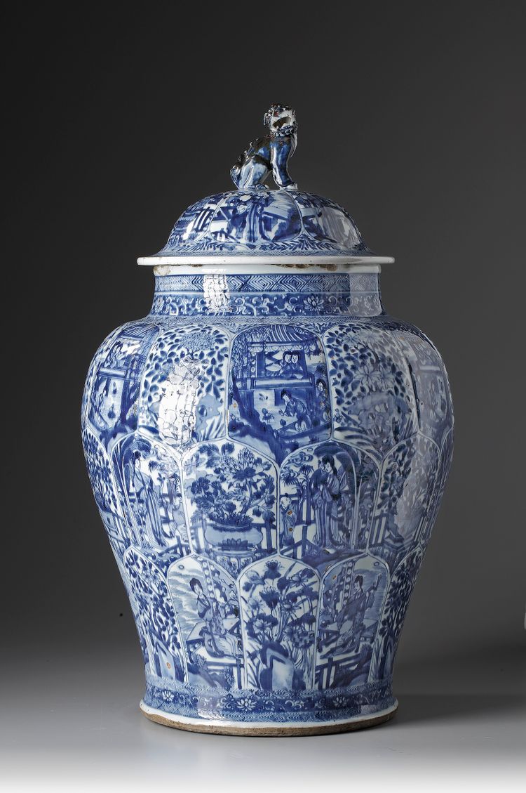 A large blue and white jar with cover
