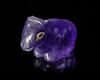 A WESTERN ASIATIC HARDSTONE AMULET OF A SEATED COW OR OX, CIRCA 2ND-1ST CENTURY B.C.