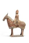 A Chinese painted pottery equestrian