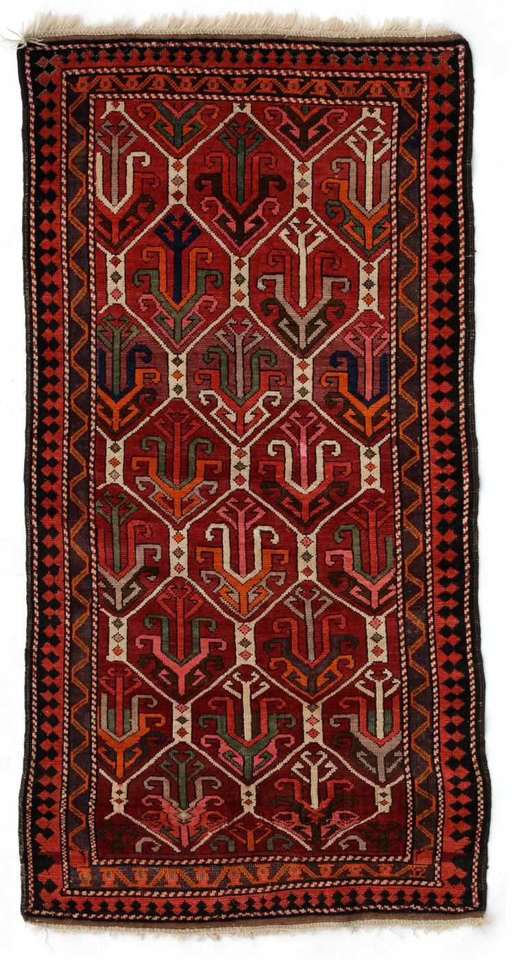 A CAUCASIAN GENDJE KAZAK RUG, CIRCA 1920