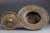 An Islamic silver inlaid brass hand wash bowl
