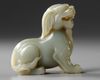 A PALE GREEN JADE CARVING OF A QILIN, 19TH CENTURY