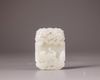 A Chinese very pale celadon jade 'tiger and phoenix' plaque
