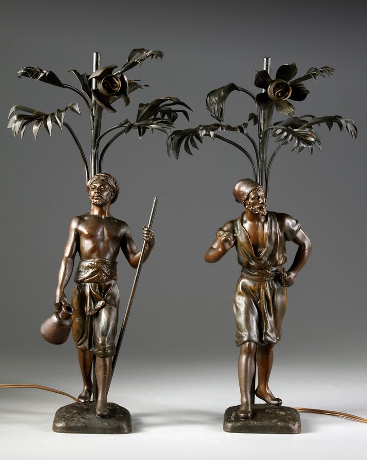 A PAIR OF ORIENTAL 'WATER CARRIERS' SCULPTURES , MARCEL DEBUT