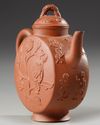 A Chinese yixing 'peony and chilong' flattened teapot and cover