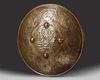 A QAJAR GILT COPPER SHIELD, PERSIA, 19TH CENTURY