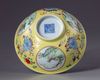 A Chinese famille rose yellow-ground sgraffiato 'Three Rams' medallion bowl