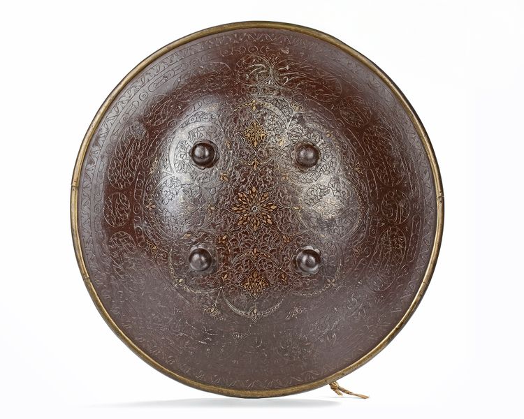 A QAJAR GOLD-DAMASCENED STEEL SHIELD, PERSIA, 19TH CENTURY